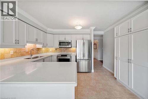 1272 Ontario Street Unit# 404, Burlington, ON - Indoor Photo Showing Kitchen With Double Sink