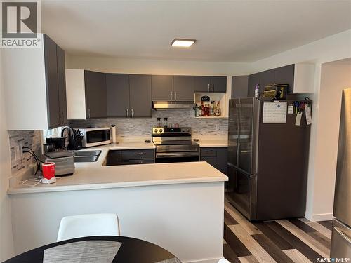 132 Barber Crescent, Saskatoon, SK - Indoor Photo Showing Kitchen With Double Sink