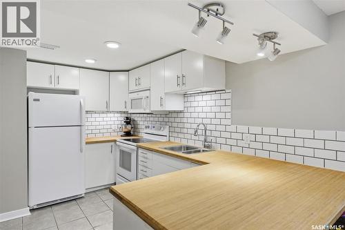16 Pinder Crescent, Saskatoon, SK - Indoor Photo Showing Kitchen With Double Sink