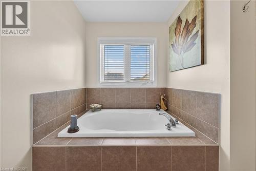 Bathroom featuring a bath - 97 Sirente Drive, Hamilton, ON - Indoor Photo Showing Bathroom