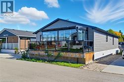 View of front of home featuring a sunroom and crawl space - 