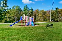 Communal playground featuring a yard - 