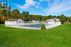 View of pool featuring view of wooded area - 