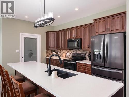 348 Dusty Trail, Whitehorse North, YT - Indoor Photo Showing Kitchen With Double Sink