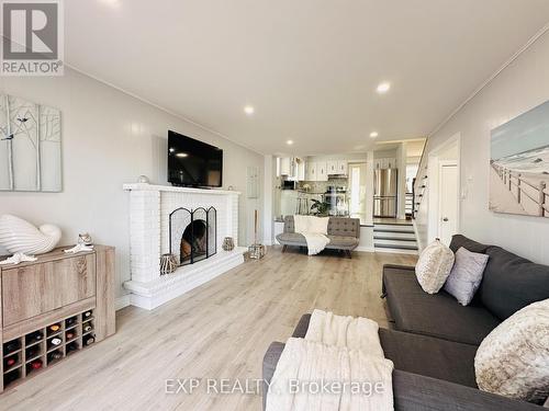 25 Turtle Path, Ramara, ON - Indoor Photo Showing Living Room With Fireplace