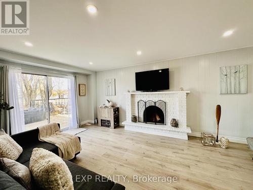 25 Turtle Path, Ramara, ON - Indoor Photo Showing Living Room With Fireplace