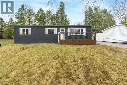 View of front facade featuring a wooden deck and a front lawn - 157 Maple Crescent, Hamilton, ON - Outdoor With Deck Patio Veranda