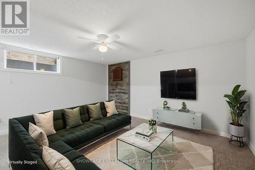 Recreation room is virtually staged - angle 2. - 2 Harrington Crescent, St. Thomas, ON - Indoor Photo Showing Living Room