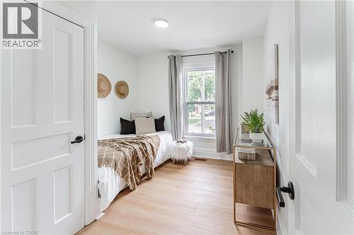 Spacious bedroom with closet & window for natural light. - 15 Barnesdale Avenue N, Hamilton, ON - Indoor Photo Showing Bedroom