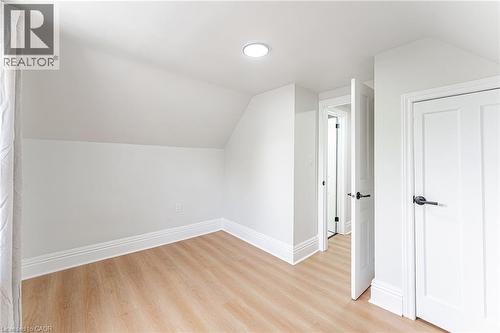 Bedroom with closet, hardwood & bright window. - 15 Barnesdale Avenue N, Hamilton, ON - Indoor Photo Showing Other Room