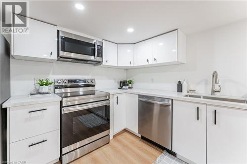 STUNNING Kitchen #3 will impress includes separate laundry area!! - 15 Barnesdale Avenue N, Hamilton, ON - Indoor Photo Showing Kitchen