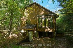 Rear Elevation / Exterior Entrance to Basement - 
