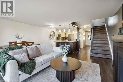 Living area with stairway and dark wood-type flooring - 27 Red Clover Crescent, Kitchener, ON - Indoor Photo Showing Living Room