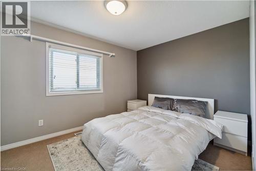 Bedroom featuring carpet and baseboards - 27 Red Clover Crescent, Kitchener, ON - Indoor Photo Showing Bedroom