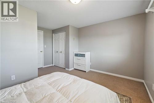 Bedroom featuring light colored carpet and a closet - 27 Red Clover Crescent, Kitchener, ON - Indoor Photo Showing Bedroom