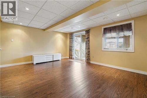 Spare room featuring a paneled ceiling, dark wood finished floors, and recessed lighting - 27 Red Clover Crescent, Kitchener, ON - Indoor Photo Showing Other Room