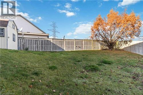 Fenced backyard featuring a storage unit - 27 Red Clover Crescent, Kitchener, ON - Outdoor