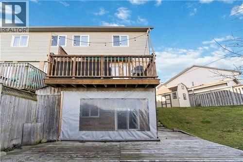 Back of property with a deck, a shed, and a fenced backyard - 27 Red Clover Crescent, Kitchener, ON - Outdoor With Deck Patio Veranda