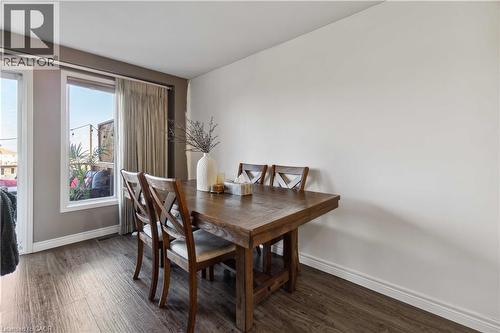 Dining area with dark wood-style flooring - 27 Red Clover Crescent, Kitchener, ON - Indoor Photo Showing Dining Room
