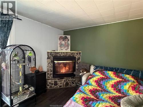 858 Laporte, Windsor, ON - Indoor Photo Showing Bedroom With Fireplace