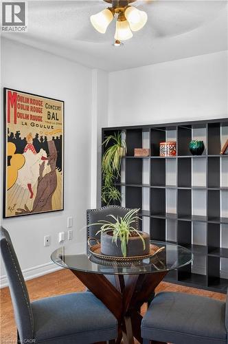 Dining area featuring wood finished floors and ceiling fan - 216 Robert Street, Hamilton, ON - Indoor