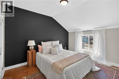 Bedroom with lofted ceiling and wood finished floors - 216 Robert Street, Hamilton, ON - Indoor Photo Showing Bedroom