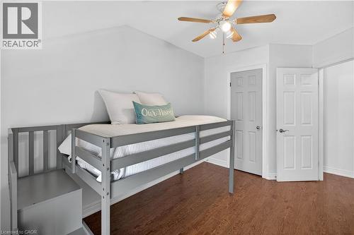 Bedroom featuring a ceiling fan, dark wood finished floors, and lofted ceiling - 216 Robert Street, Hamilton, ON - Indoor Photo Showing Bedroom