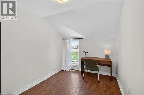 Office area with dark wood-type flooring and baseboards - 216 Robert Street, Hamilton, ON - Indoor Photo Showing Office