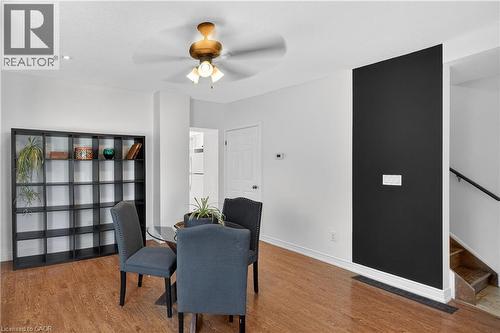 Dining area with ceiling fan and wood finished floors - 216 Robert Street, Hamilton, ON - Indoor