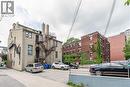 View of apartment building / complex with uncovered parking and stairs - 14 Duke Street, Hamilton, ON  - Outdoor 