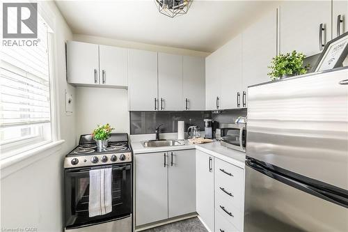 Kitchen with stainless steel appliances and light countertops - 14 Duke Street, Hamilton, ON - Indoor Photo Showing Kitchen