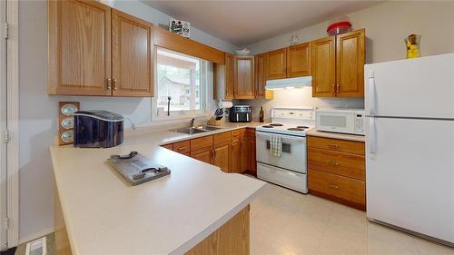 599 10 Highway, Onanole, MB - Indoor Photo Showing Kitchen With Double Sink