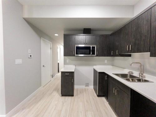 647 Toronto Street, Winnipeg, MB - Indoor Photo Showing Kitchen With Double Sink