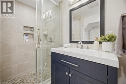 Bathroom with vanity and a stall shower - 