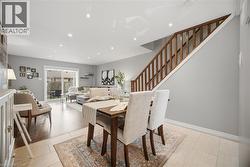Dining room featuring stairs and recessed lighting - 