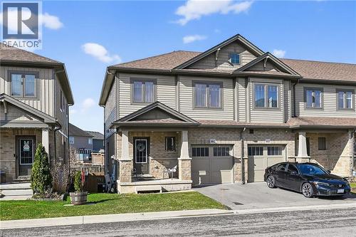 View of front of house with an attached garage, driveway, a shingled roof, and a front lawn - 80 Severino Circle, Smithville, ON - Outdoor With Facade