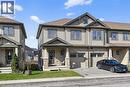 View of front of house with an attached garage, driveway, a shingled roof, and a front lawn - 80 Severino Circle, Smithville, ON  - Outdoor With Facade 