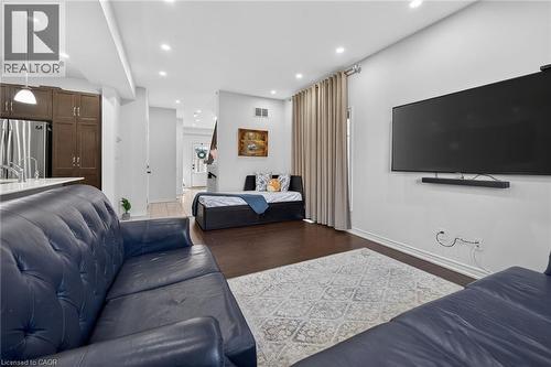 Living room with dark wood-style flooring and recessed lighting - 80 Severino Circle, Smithville, ON - Indoor Photo Showing Living Room