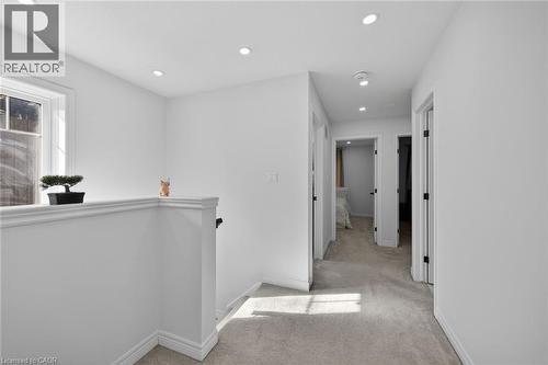 Hall featuring an upstairs landing, light carpet, and recessed lighting - 80 Severino Circle, Smithville, ON - Indoor Photo Showing Other Room