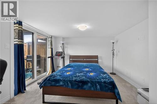 Bedroom with light colored carpet and access to outside - 80 Severino Circle, Smithville, ON - Indoor Photo Showing Bedroom