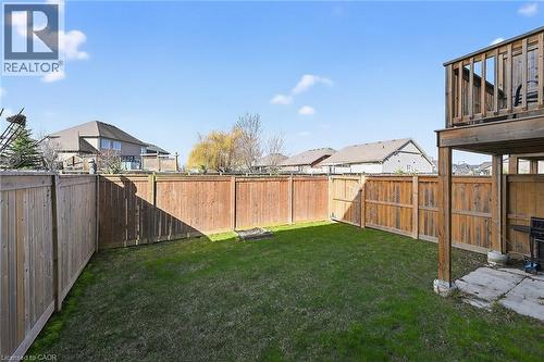 Fenced backyard featuring a residential view and a balcony - 80 Severino Circle, Smithville, ON - Outdoor