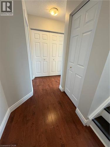 Hall featuring dark wood-type flooring and a textured ceiling - 45 Brookfield Crescent, Kitchener, ON - Indoor Photo Showing Other Room