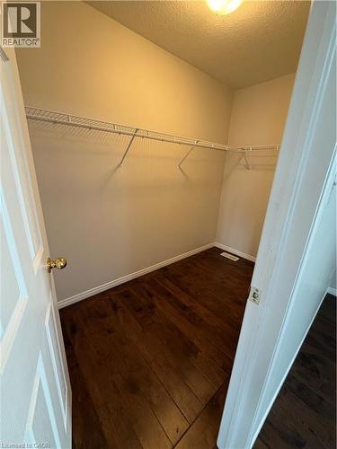 Walk in closet with dark wood finished floors - 45 Brookfield Crescent, Kitchener, ON - Indoor With Storage