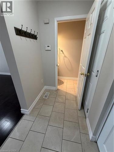 Hall featuring light tile patterned floors and baseboards - 45 Brookfield Crescent, Kitchener, ON - Indoor Photo Showing Other Room