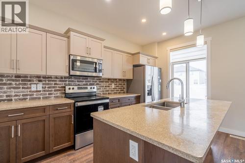4624 Buckingham Drive E, Regina, SK - Indoor Photo Showing Kitchen With Double Sink With Upgraded Kitchen