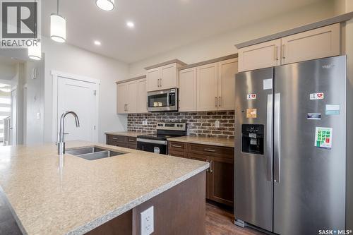 4624 Buckingham Drive E, Regina, SK - Indoor Photo Showing Kitchen With Double Sink With Upgraded Kitchen
