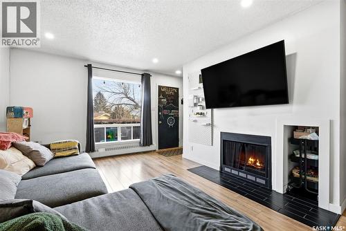 208 67 Rodenbush Drive, Regina, SK - Indoor Photo Showing Living Room With Fireplace
