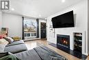 208 67 Rodenbush Drive, Regina, SK  - Indoor Photo Showing Living Room With Fireplace 