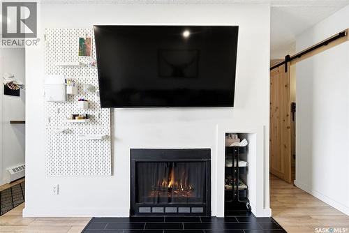 208 67 Rodenbush Drive, Regina, SK - Indoor Photo Showing Living Room With Fireplace
