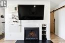 208 67 Rodenbush Drive, Regina, SK  - Indoor Photo Showing Living Room With Fireplace 